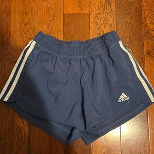Cute blue athletic shorts, cute white stripes on the sides
